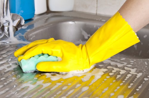 Professional carpet cleaning equipment in use on a stained floor